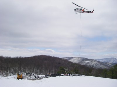 Photo of the helicopter working on the St. Mary's project in Virginia after snow.