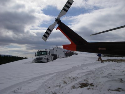 Photo of Fuel Truck and Helicopter Working on St. Mary's Project