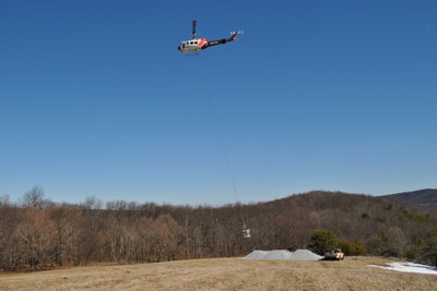 Photo of Helicopter picking up limestone at St. Mary's Project in Virginia